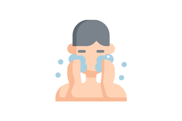 ヘアバンドをつけずに洗顔する男性