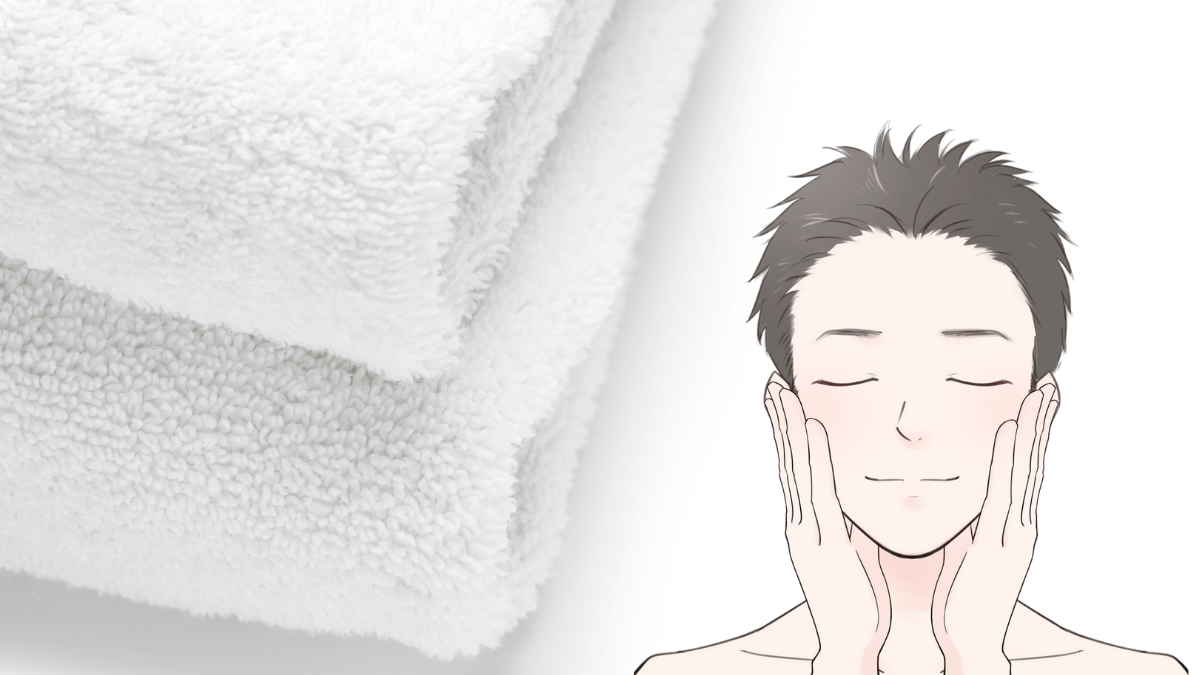 タオルで顔をやさしく拭く男性